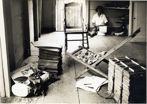 <p>Barbara Taylor (Hodge, 1913–2009), typing field notes, etc. in the estate that she and Walter H. Hodge used for initiating fieldwork for the production of a flora of Dominica, with plant presses and collecting materials in the foreground, Lisdara Estate, Dominica, summer 1937, 13 × 18 cm, photograph by Walter H. Hodge, HI Archives portrait no. 23.</p>
